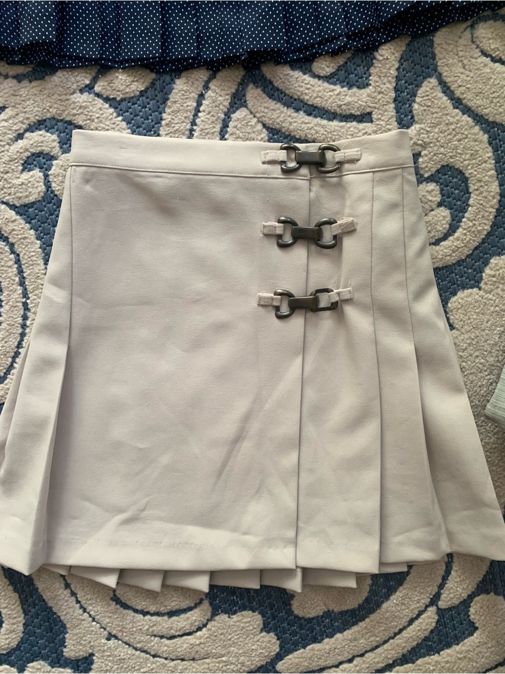 Cream Pleated A-Line Skirt with Metal Buckle Detail